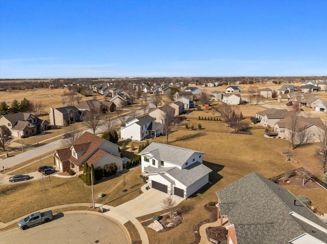 birds eye view of property with a residential view