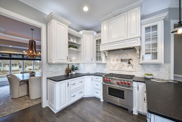 kitchen featuring dark countertops, designer range, dark wood-style floors, a notable chandelier, and white cabinetry