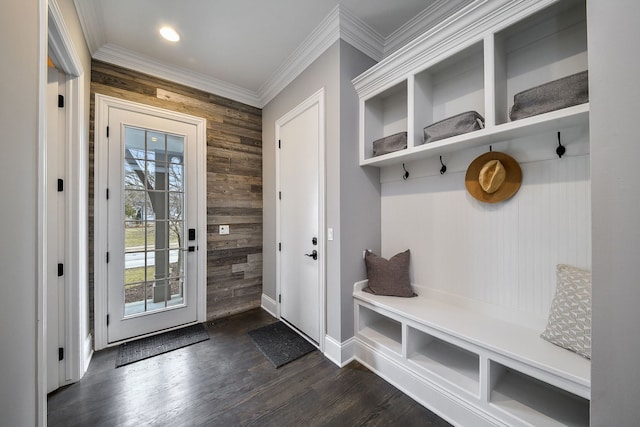 mudroom with recessed lighting, wooden walls, crown molding, baseboards, and dark wood-style flooring