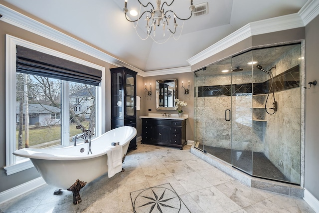 full bathroom featuring lofted ceiling, vanity, ornamental molding, and a shower stall