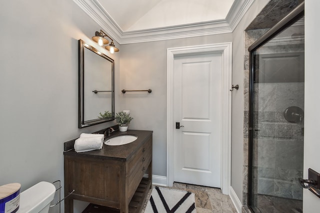 bathroom with vanity, a shower stall, toilet, and ornamental molding