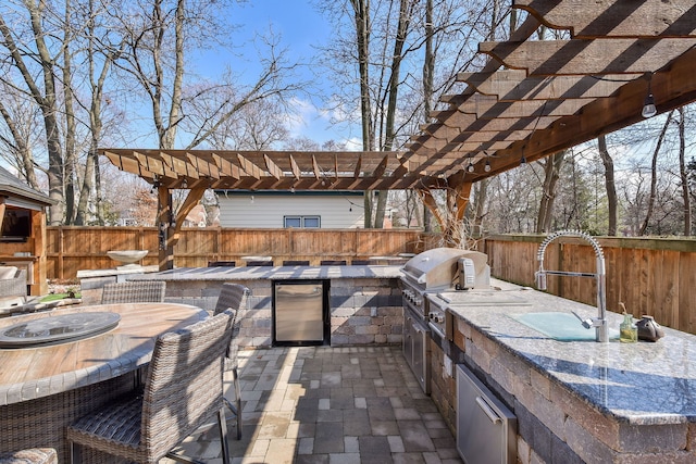 view of patio / terrace featuring area for grilling, outdoor dining area, a fenced backyard, and a pergola