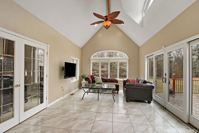 sunroom featuring a ceiling fan, lofted ceiling, and french doors