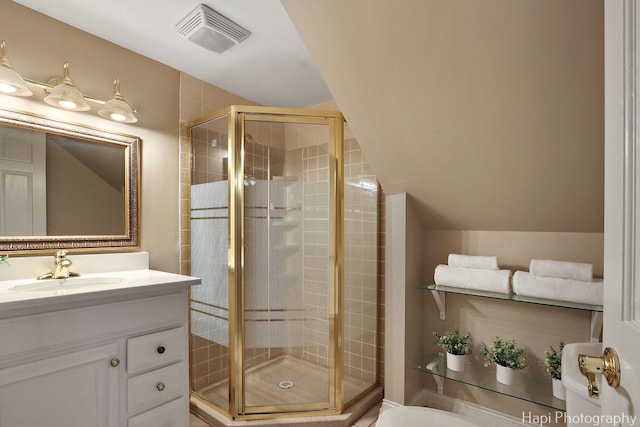 bathroom featuring visible vents, lofted ceiling, vanity, and a shower stall