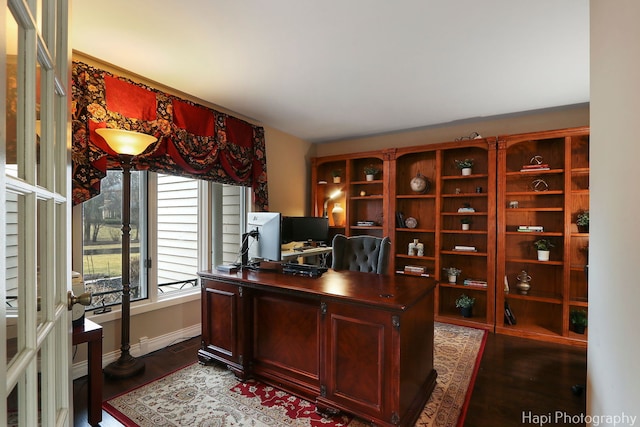 home office with dark wood finished floors and baseboards