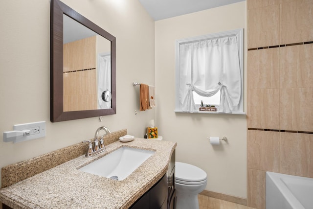 full bathroom with toilet, vanity, a tub, baseboards, and walk in shower