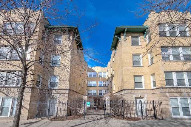 view of building exterior featuring a fenced front yard