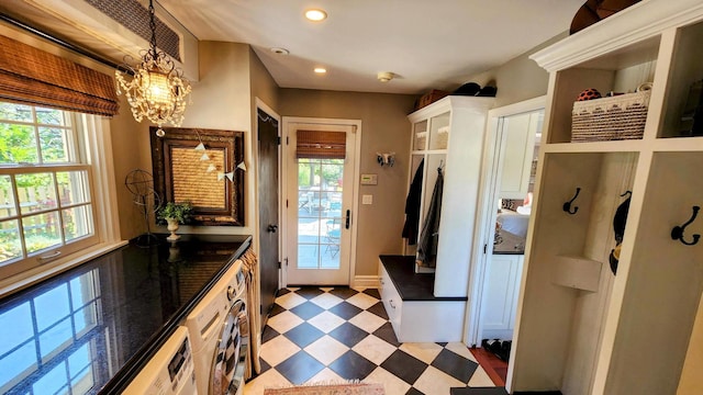 mudroom featuring washer / dryer, baseboards, light floors, a chandelier, and recessed lighting