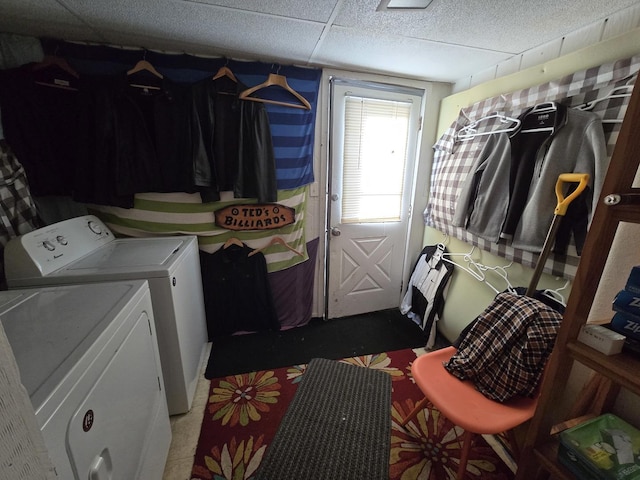 laundry area with a textured ceiling, laundry area, and separate washer and dryer