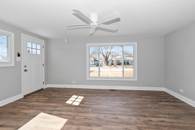 entryway with wood finished floors, a ceiling fan, and baseboards