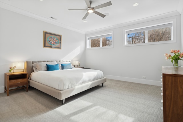 carpeted bedroom with visible vents, recessed lighting, crown molding, baseboards, and ceiling fan