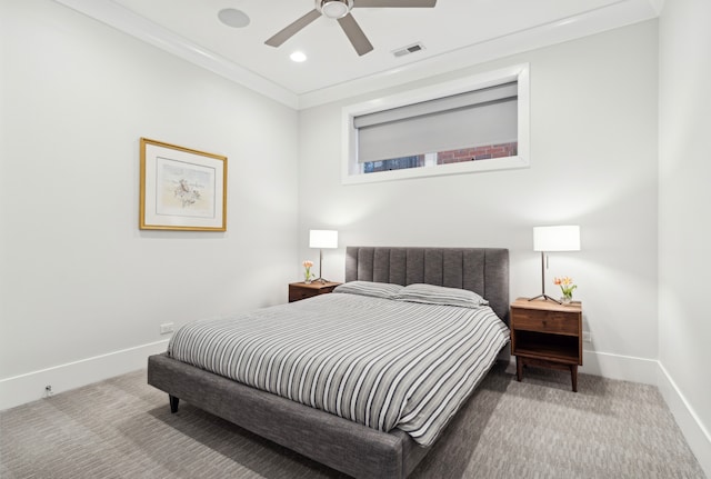 carpeted bedroom featuring visible vents, crown molding, baseboards, recessed lighting, and a ceiling fan