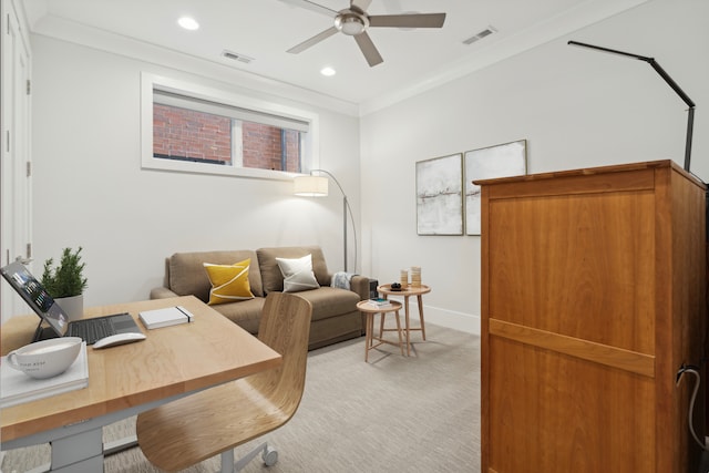 home office featuring light carpet, visible vents, crown molding, and a ceiling fan