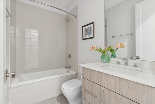 bathroom with toilet, vanity, and washtub / shower combination