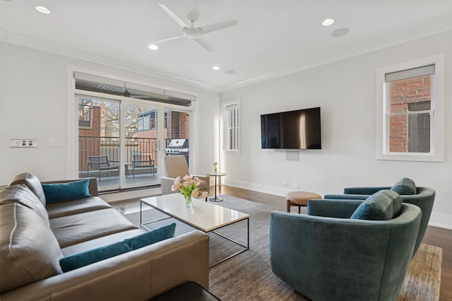 living room featuring a ceiling fan, recessed lighting, wood finished floors, and baseboards