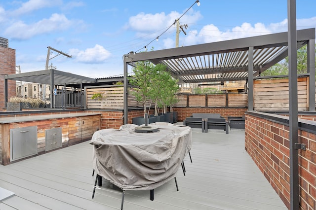 wooden deck featuring a pergola