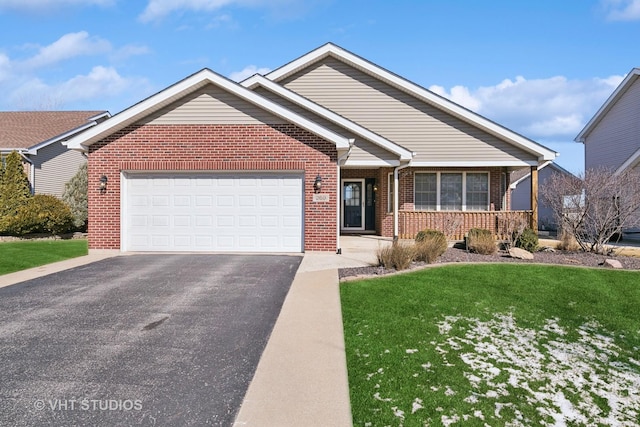 ranch-style house featuring a garage, a front yard, brick siding, and driveway