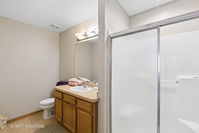 full bathroom featuring visible vents, toilet, a shower stall, vanity, and tile patterned floors