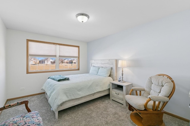 bedroom featuring baseboards and carpet flooring