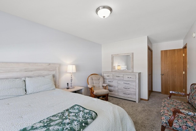 carpeted bedroom featuring baseboards