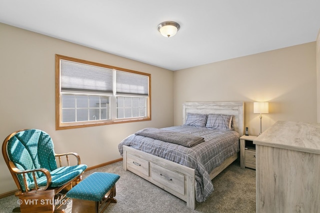 carpeted bedroom featuring baseboards