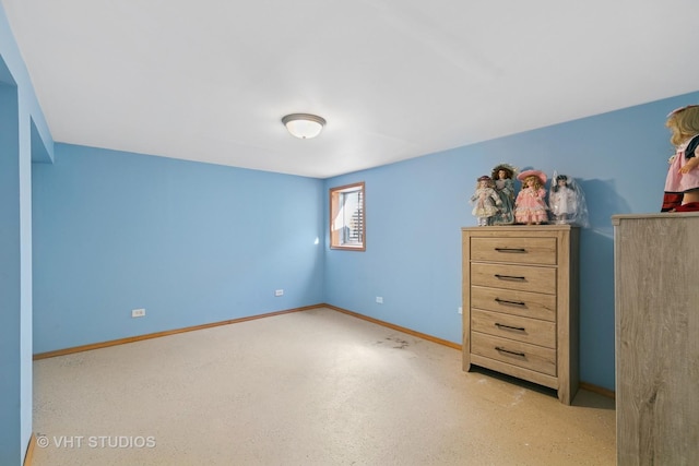 unfurnished bedroom with baseboards