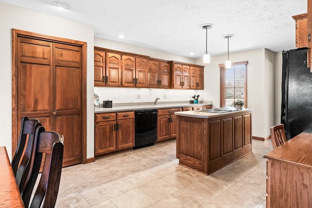 kitchen with black appliances, decorative light fixtures, a kitchen island, backsplash, and light countertops