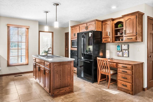 kitchen with a kitchen island, open shelves, black appliances, built in desk, and brown cabinets