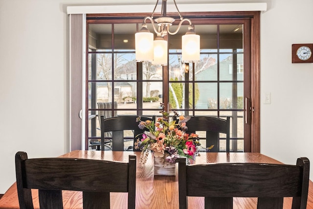 dining space with an inviting chandelier