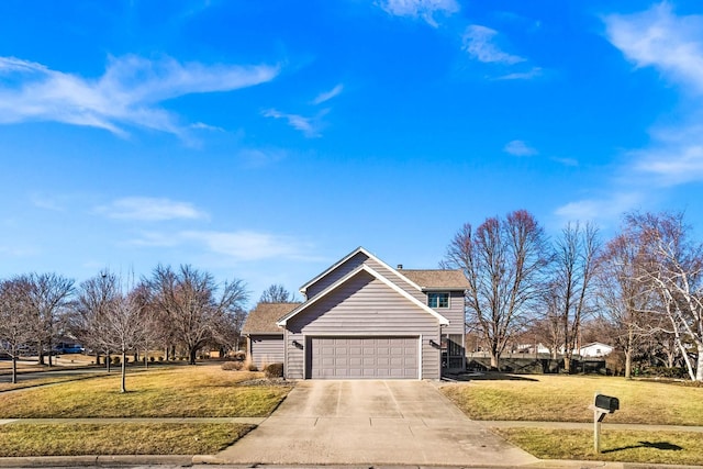 view of side of home with a lawn, an attached garage, and driveway