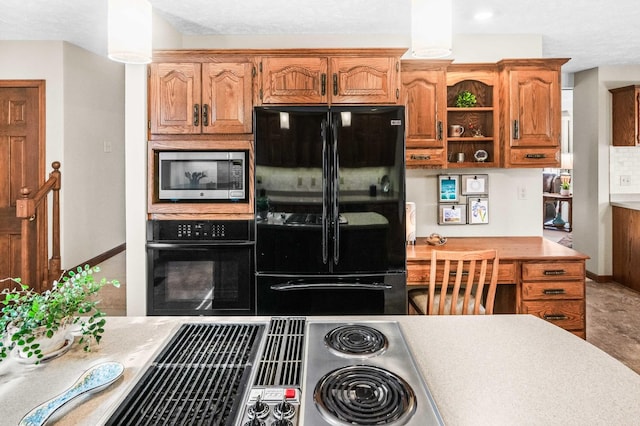 kitchen featuring baseboards, open shelves, black appliances, light countertops, and brown cabinets