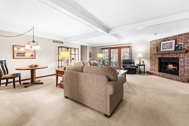 living area with light carpet, visible vents, baseboards, and beam ceiling