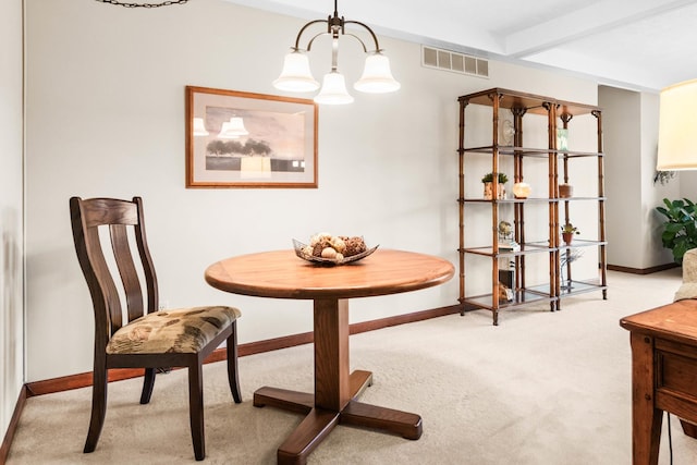 carpeted dining space featuring a notable chandelier, visible vents, beamed ceiling, and baseboards