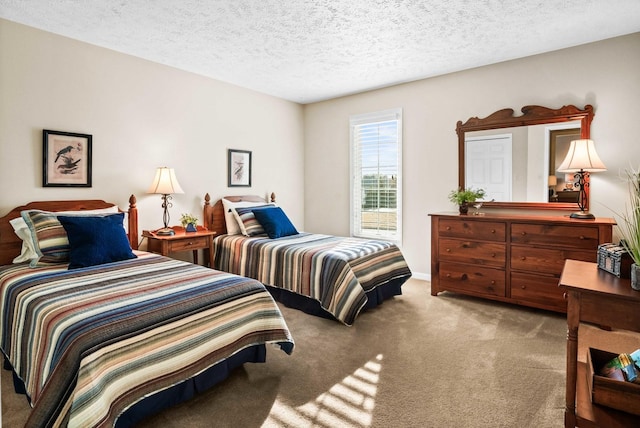 carpeted bedroom featuring a textured ceiling