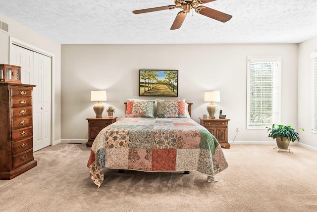 bedroom featuring light carpet, visible vents, and baseboards