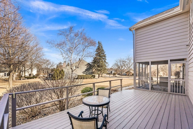 wooden terrace featuring a sunroom