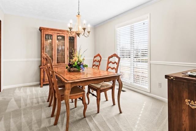 dining room featuring light carpet, baseboards, crown molding, and an inviting chandelier