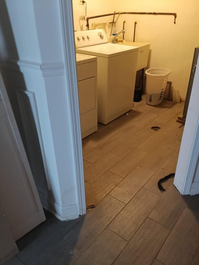 5348 S Peoria St, Chicago, IL 60609 - laundry room with washer and dryer and wood finish floors