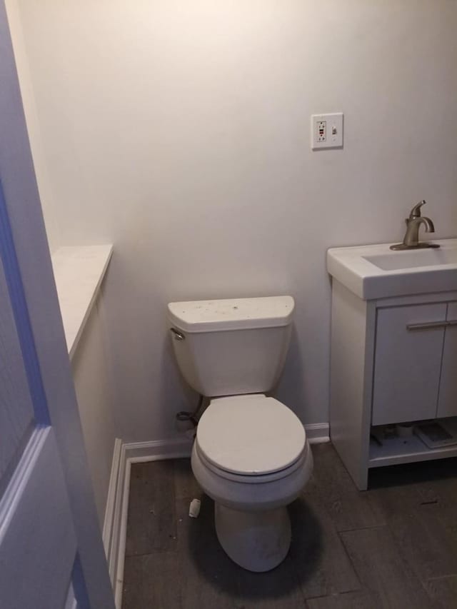 5348 S Peoria St, Chicago, IL 60609 - half bath featuring vanity and wood finished floors