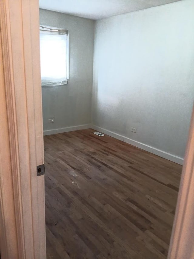 5348 S Peoria St, Chicago, IL 60609 - unfurnished room featuring dark wood-style floors and baseboards