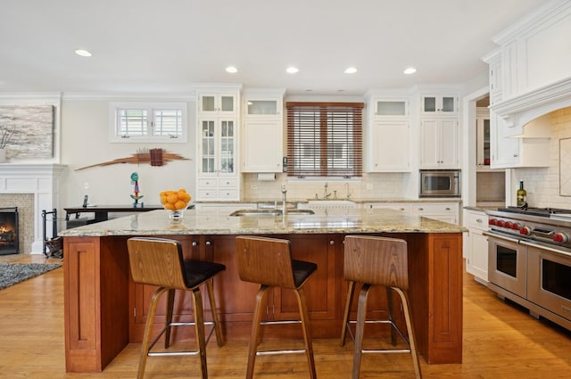 384 Provident Ave, Winnetka, IL 60093 - kitchen featuring stainless steel appliances, a sink, tasteful backsplash, white cabinetry, and recessed lighting