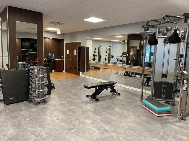 gym featuring visible vents and a drop ceiling