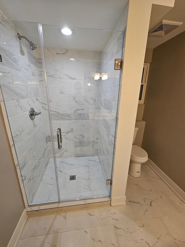 full bath with a stall shower, visible vents, baseboards, toilet, and marble finish floor