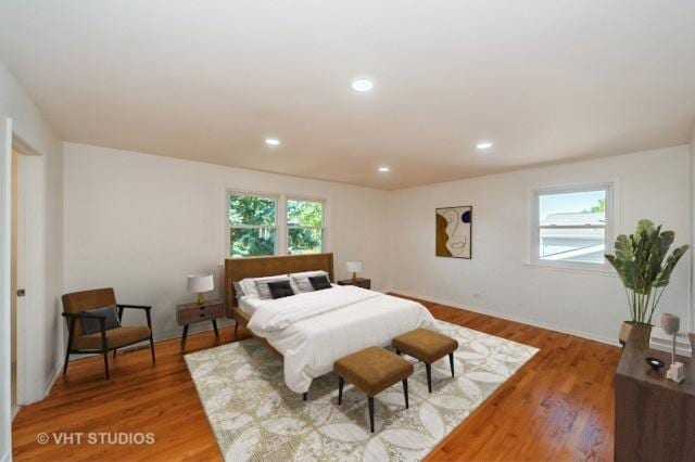 bedroom with light wood-style flooring and recessed lighting