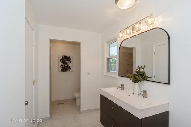 full bath with marble finish floor, double vanity, toilet, and baseboards