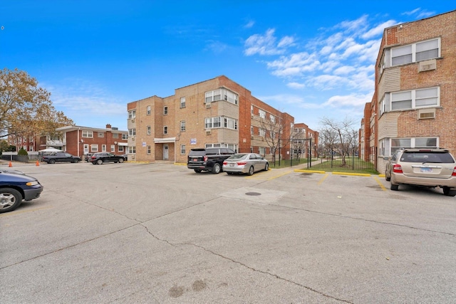 view of property featuring uncovered parking