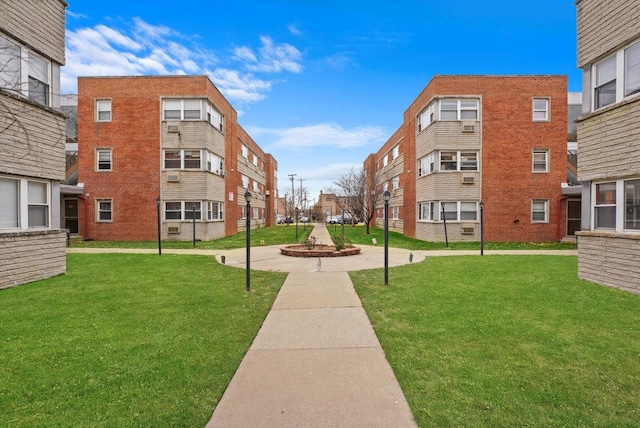 view of home's community featuring a yard