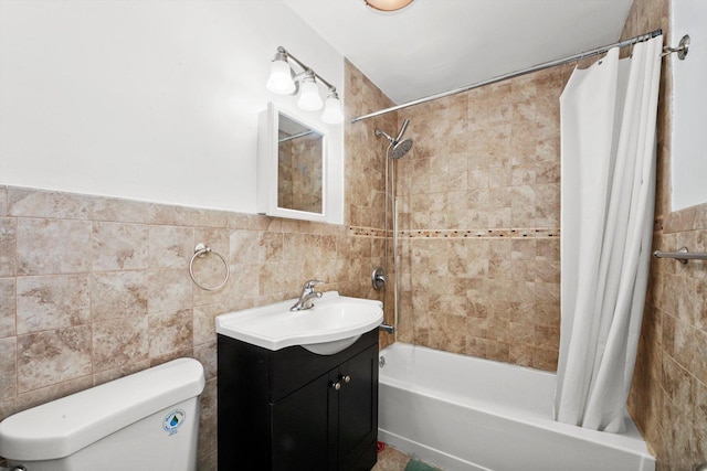 full bath featuring toilet, vanity, tile walls, and shower / tub combo with curtain