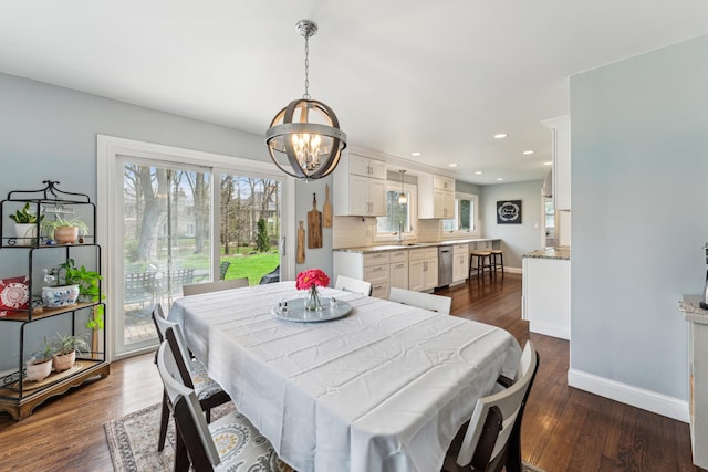 dining area featuring dark wood-style floors, recessed lighting, a chandelier, and baseboards
