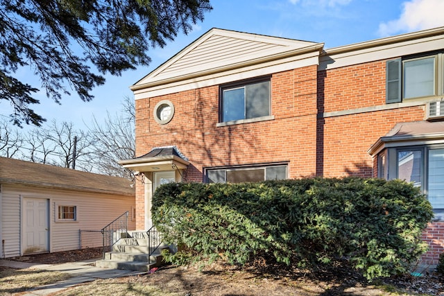 exterior space featuring brick siding